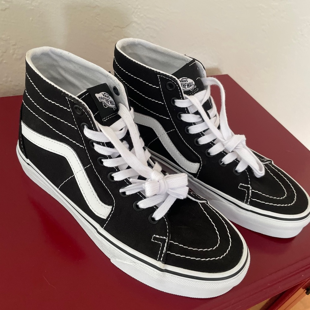 high top vans - never worn! Men's 7.5 and women's 9